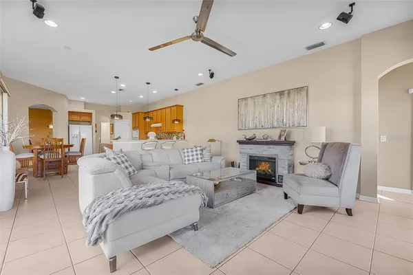 a living room with furniture and a fireplace