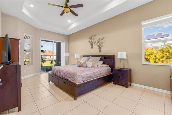 a spacious bedroom with a bed and a window