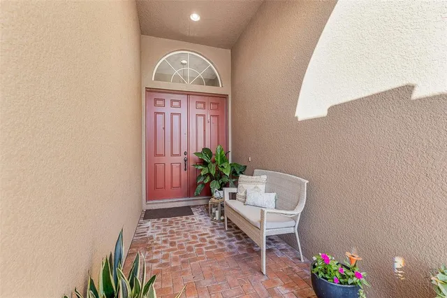 a balcony with table and chairs