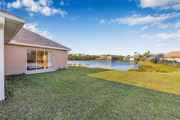 a view of a house with outdoor space and lake view