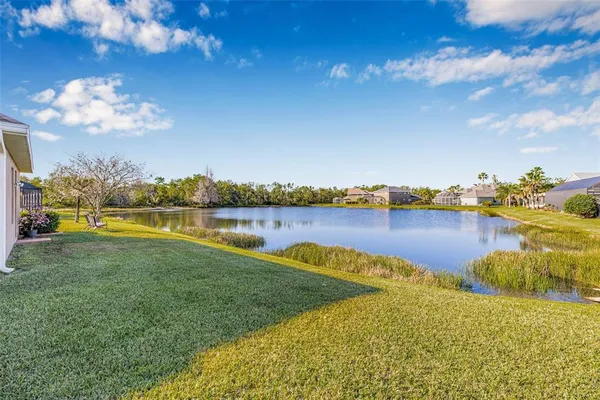 a view of a lake with a big yard