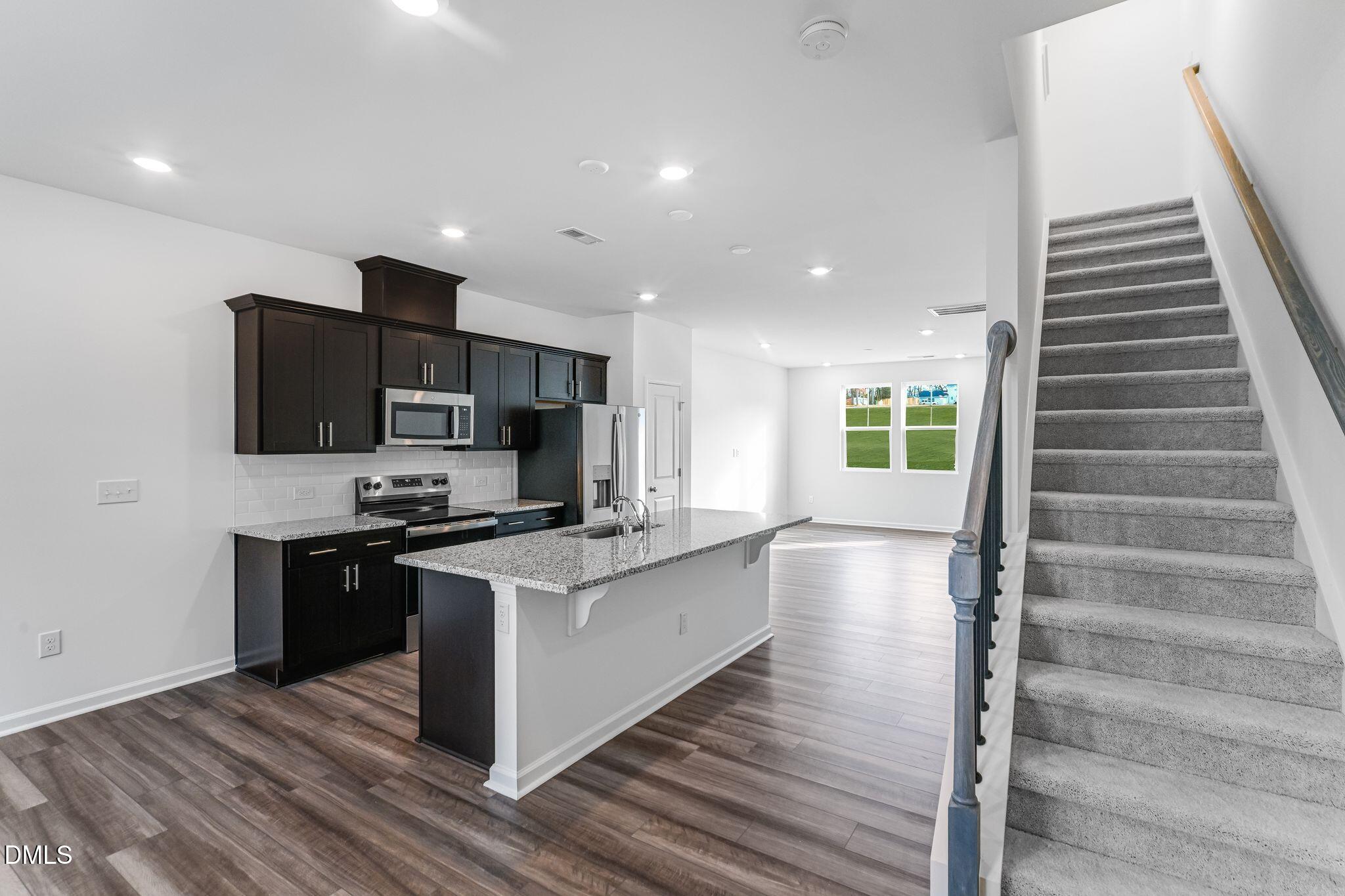 2302 Oakwood Mdws Court Raleigh, NC 27604 - Photo 11 of 28 SUN_ElmGrove_Pic_Jackson_QMI_19_Stairs_1