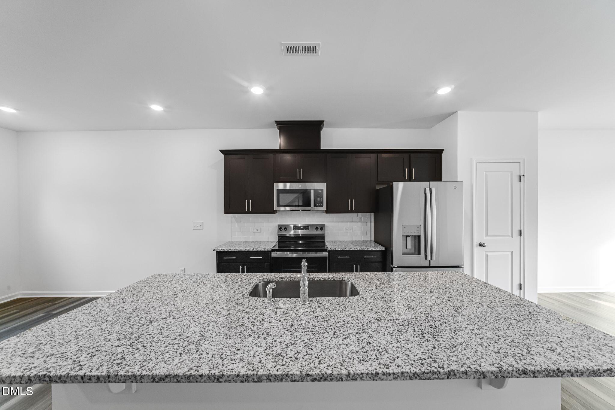 2302 Oakwood Mdws Court Raleigh, NC 27604 - Photo 9 of 28 SUN_ElmGrove_Pic_Jackson_QMI_19_Kitchen_