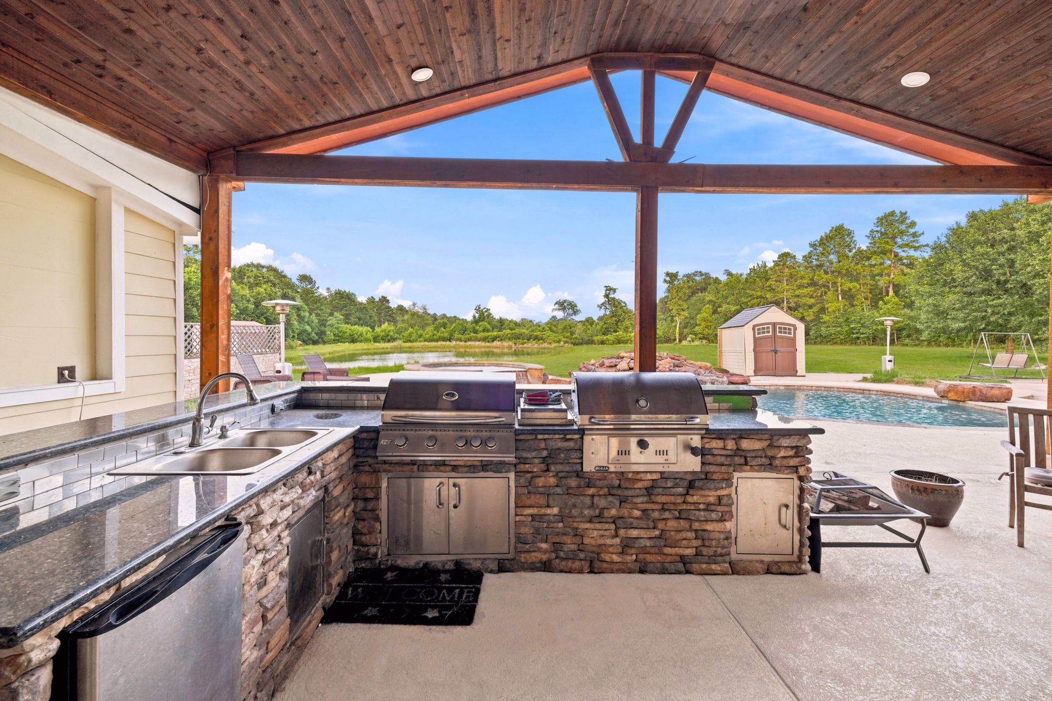 144 Wood Farm Road Huntsville, TX 77320 - Photo 36 of 50 a view of a swimming pool with a patio