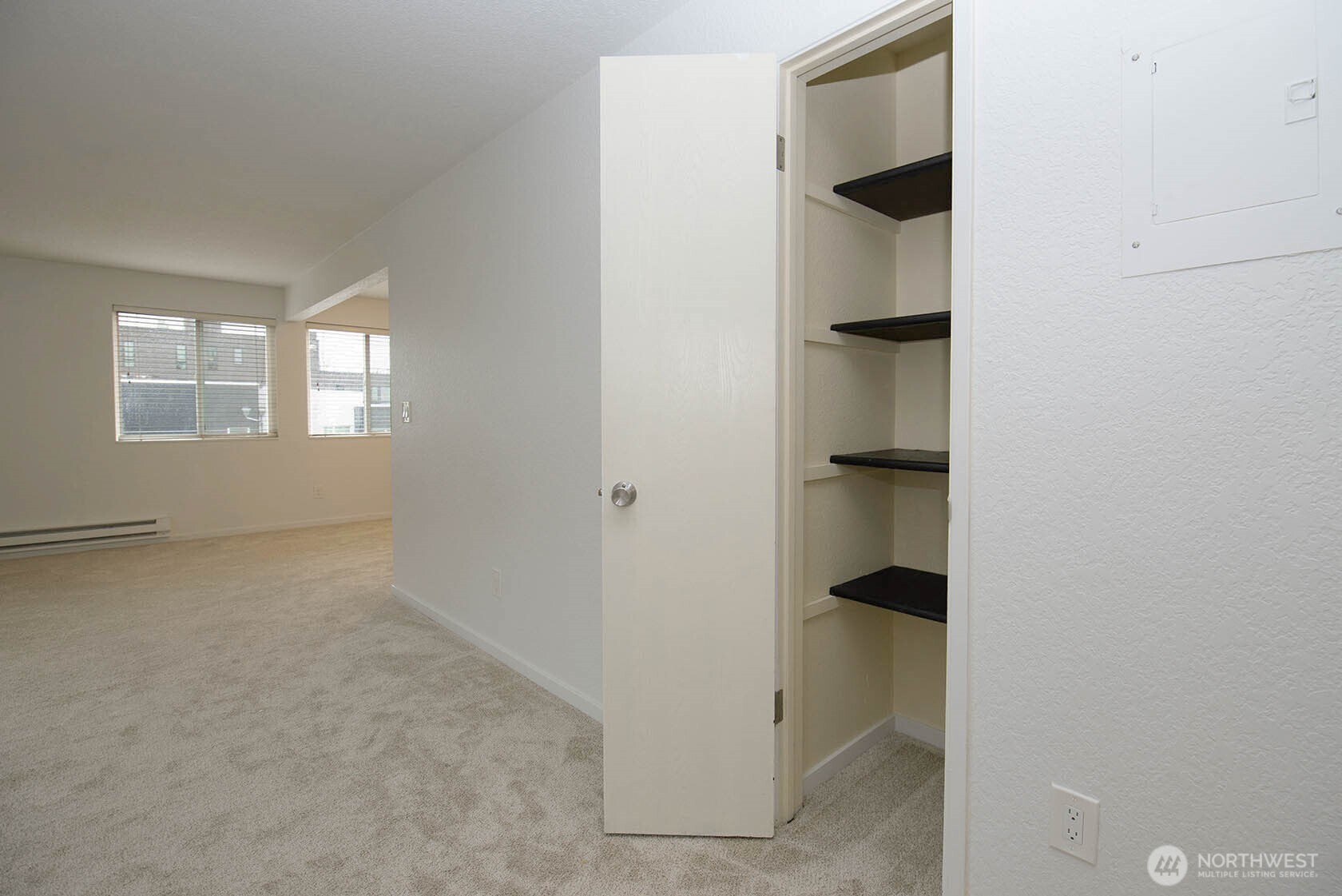 8747 Phinney Avenue North, Unit 13 Seattle, WA 98103 - Photo 11 of 32 an empty room with windows