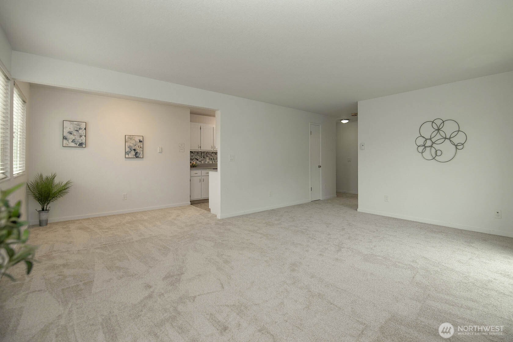8747 Phinney Avenue North, Unit 13 Seattle, WA 98103 - Photo 12 of 32 an empty room with windows and closet