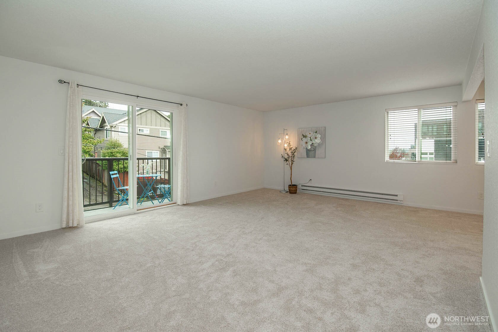 8747 Phinney Avenue North, Unit 13 Seattle, WA 98103 - Photo 13 of 32 an empty room with windows