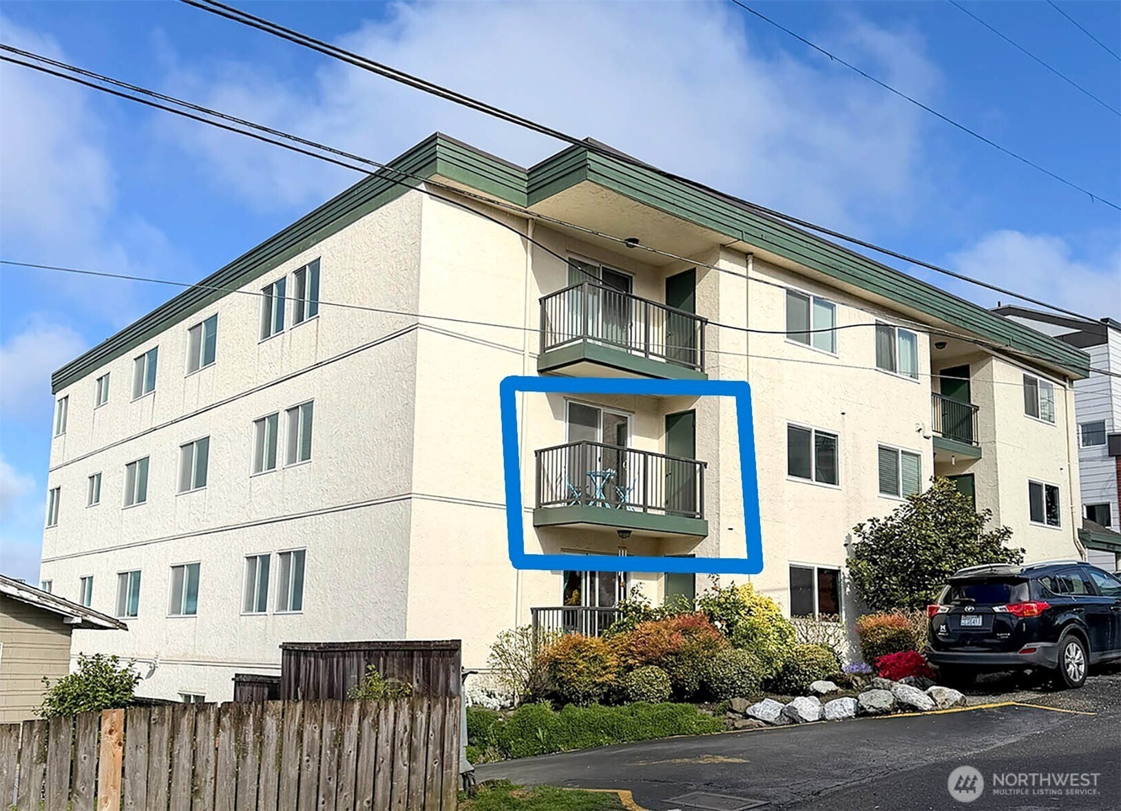 8747 Phinney Avenue North, Unit 13 Seattle, WA 98103 - Photo 2 of 32 a car parked on the side of a street