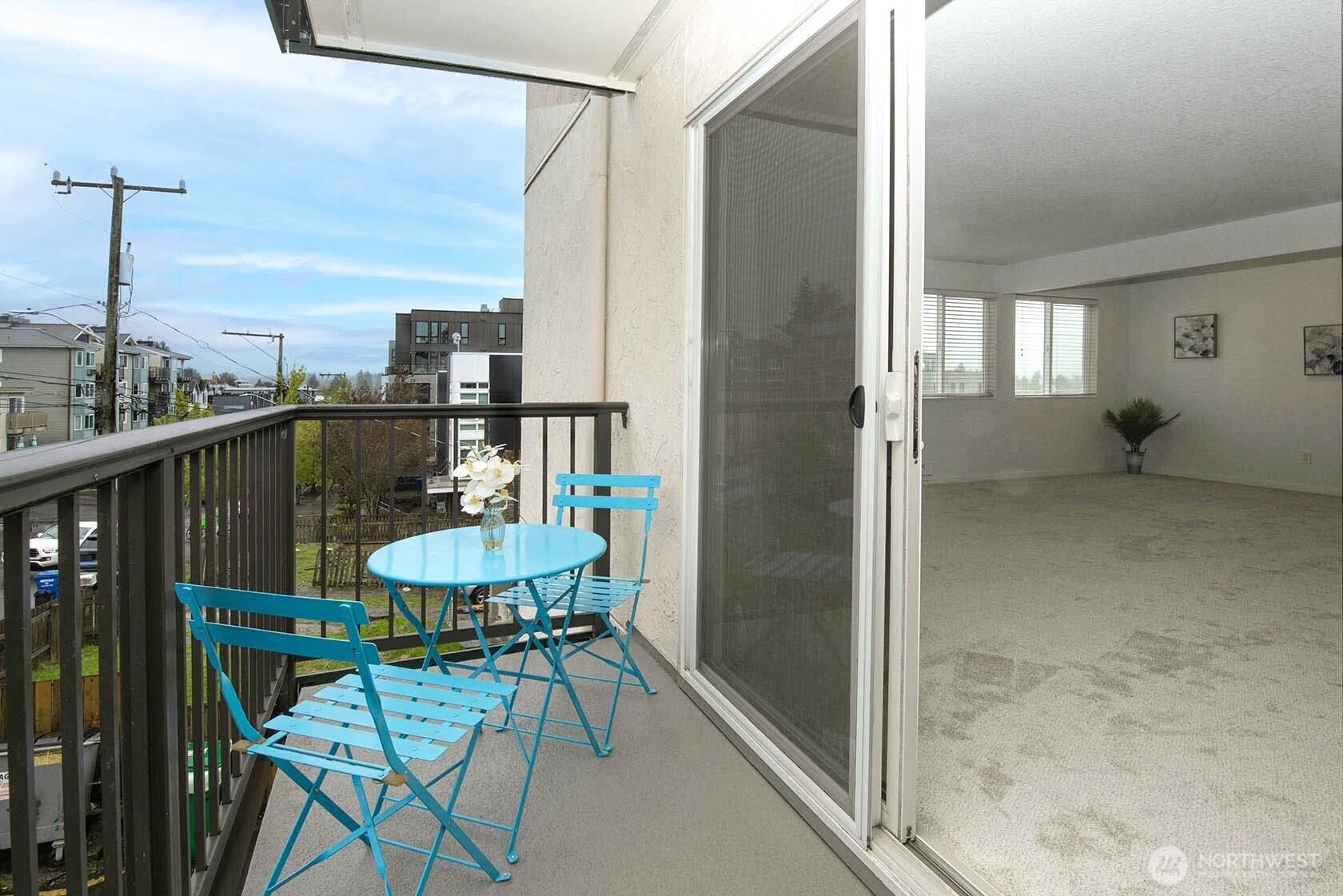 8747 Phinney Avenue North, Unit 13 Seattle, WA 98103 - Photo 26 of 32 a balcony with table and chairs