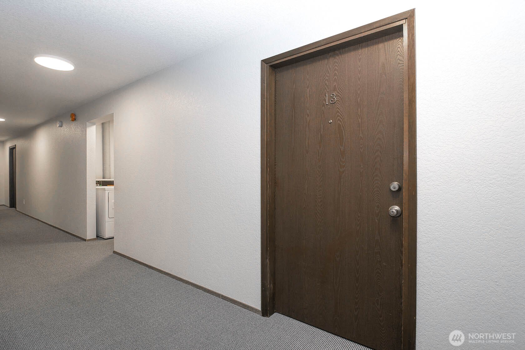 8747 Phinney Avenue North, Unit 13 Seattle, WA 98103 - Photo 30 of 32 a view of hallway with shower