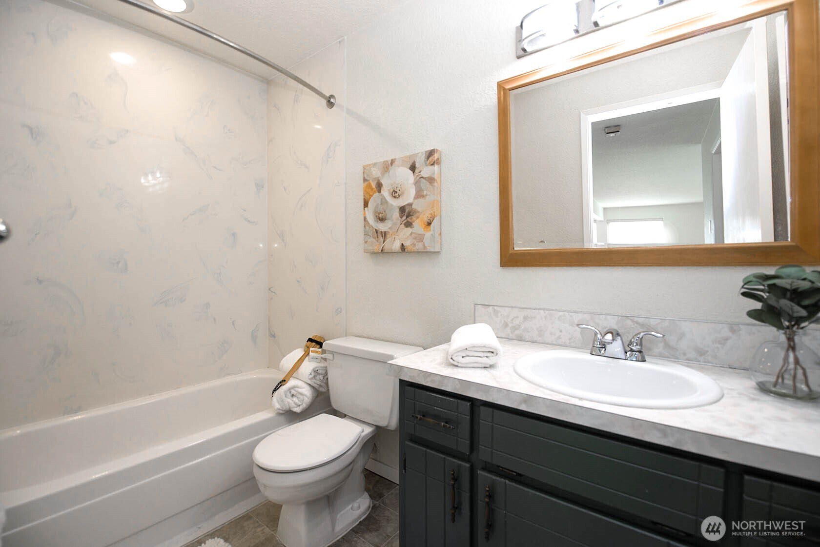 8747 Phinney Avenue North, Unit 13 Seattle, WA 98103 - Photo 5 of 32 a bathroom with a sink toilet and a bathtub