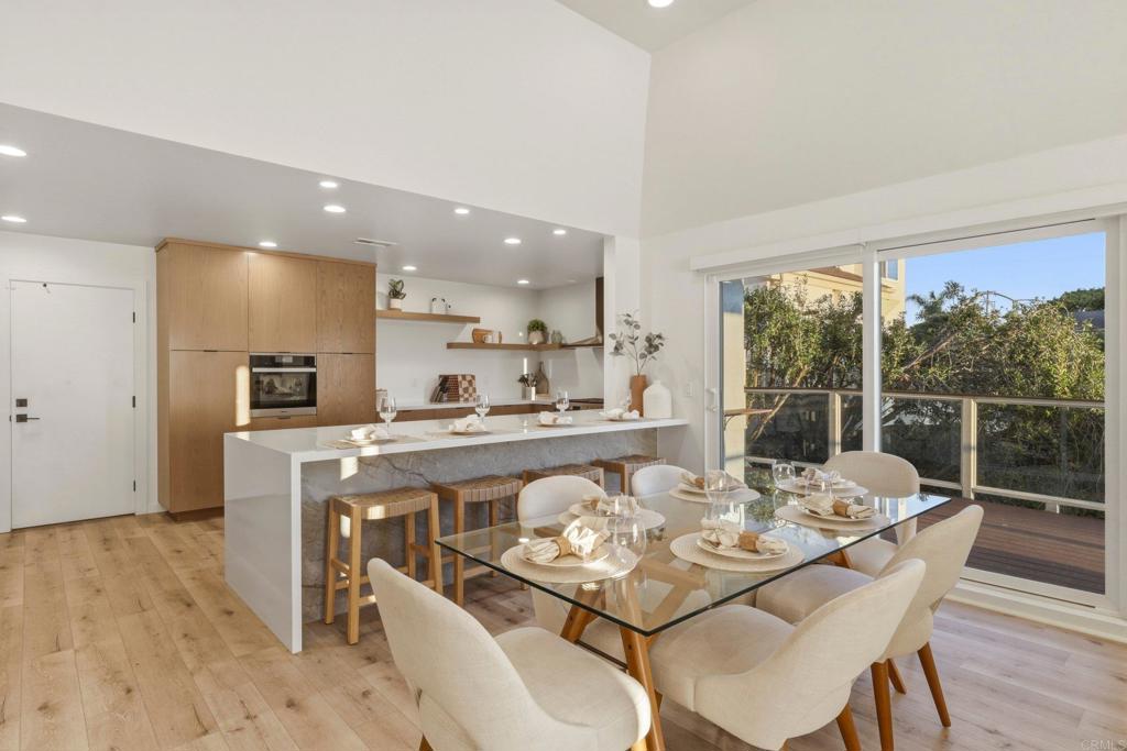 1712 Burgundy Road Encinitas, CA 92024 - Photo 11 of 31 a view of a dining room with furniture window and wooden floor