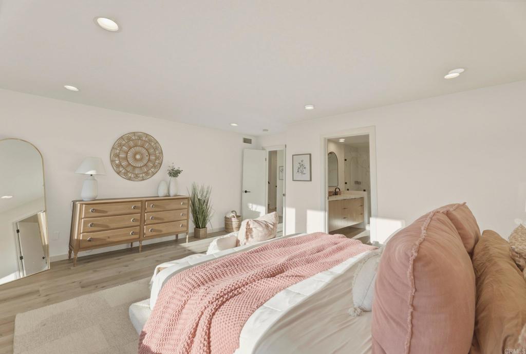 1712 Burgundy Road Encinitas, CA 92024 - Photo 14 of 31 a bedroom with a bed and a lamp on table