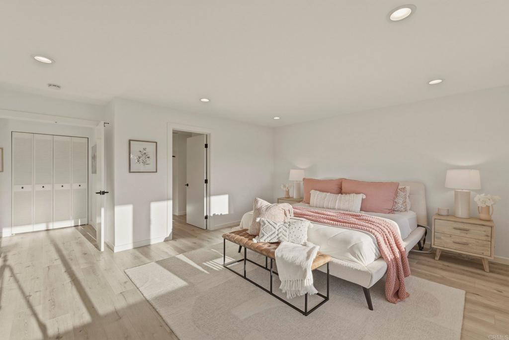 1712 Burgundy Road Encinitas, CA 92024 - Photo 15 of 31 a bedroom with a bed and a couch