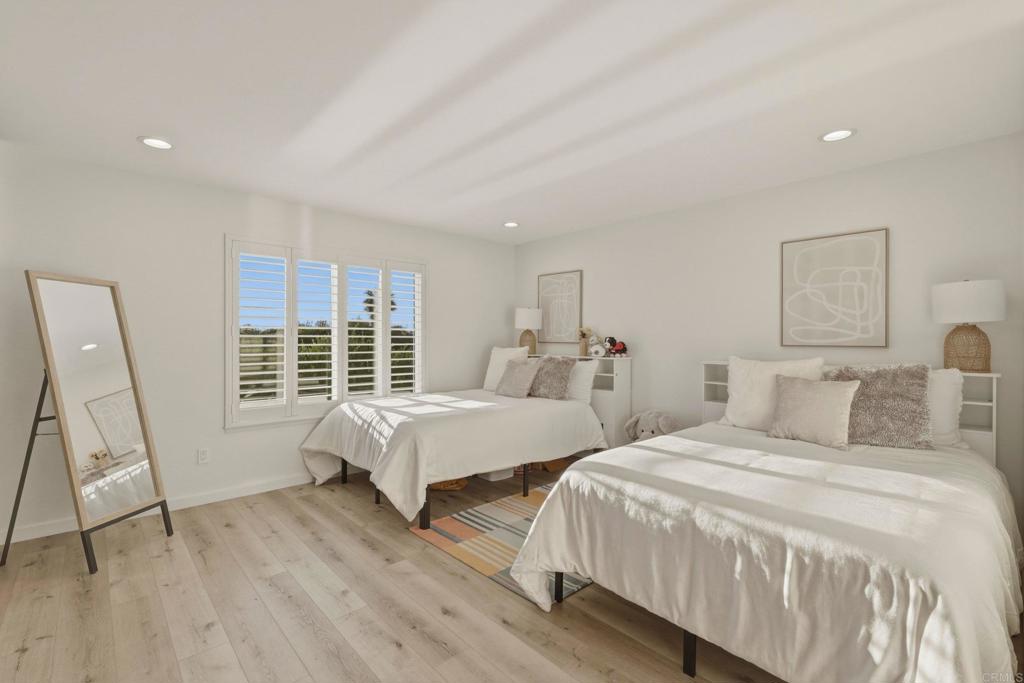 1712 Burgundy Road Encinitas, CA 92024 - Photo 19 of 31 a bedroom with two beds and a large window