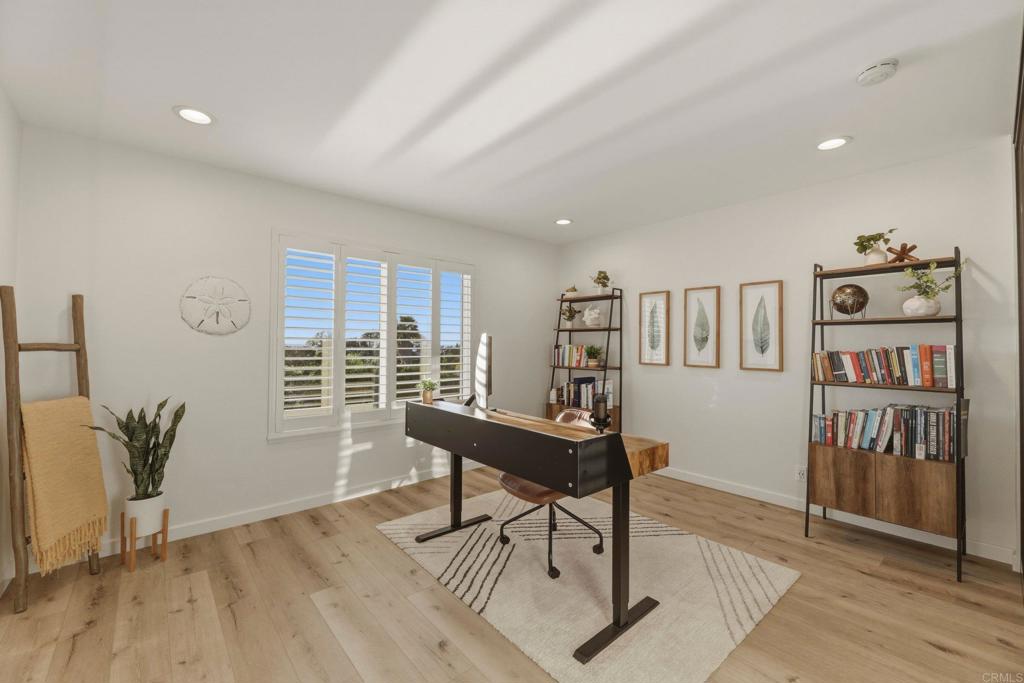 1712 Burgundy Road Encinitas, CA 92024 - Photo 21 of 31 a workspace with furniture window and wooden floor