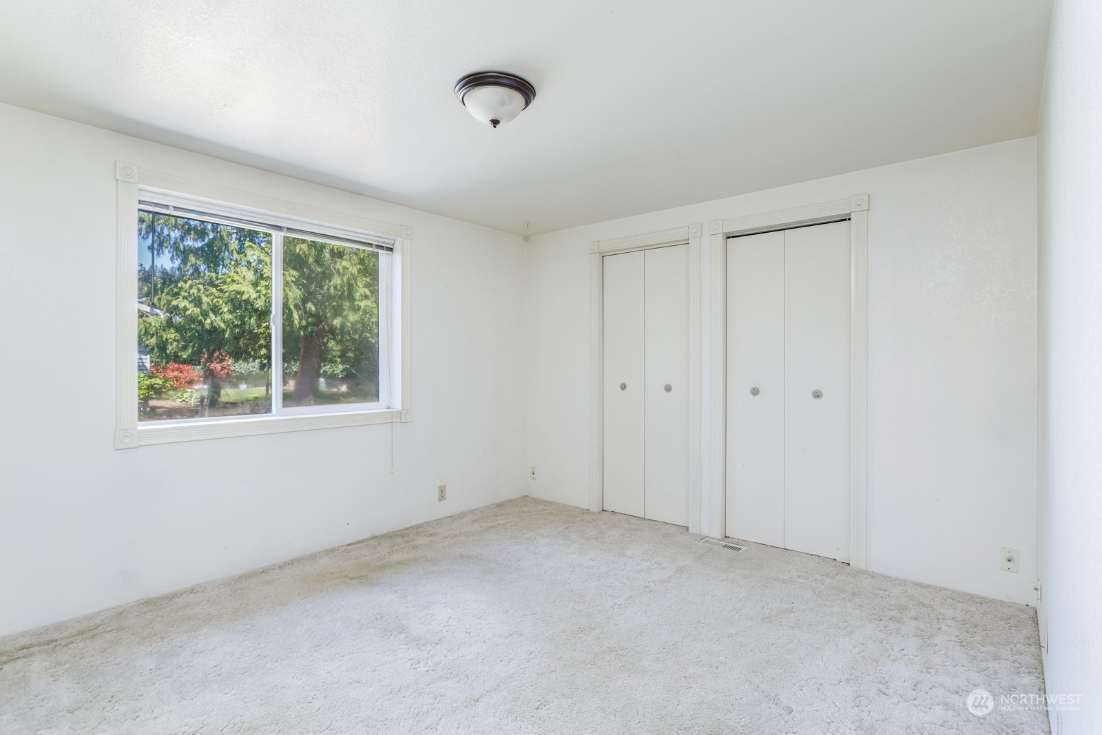 23725 Lake Drive East Bothell, WA 98021 - Photo 13 of 21 a view of an empty room with a window