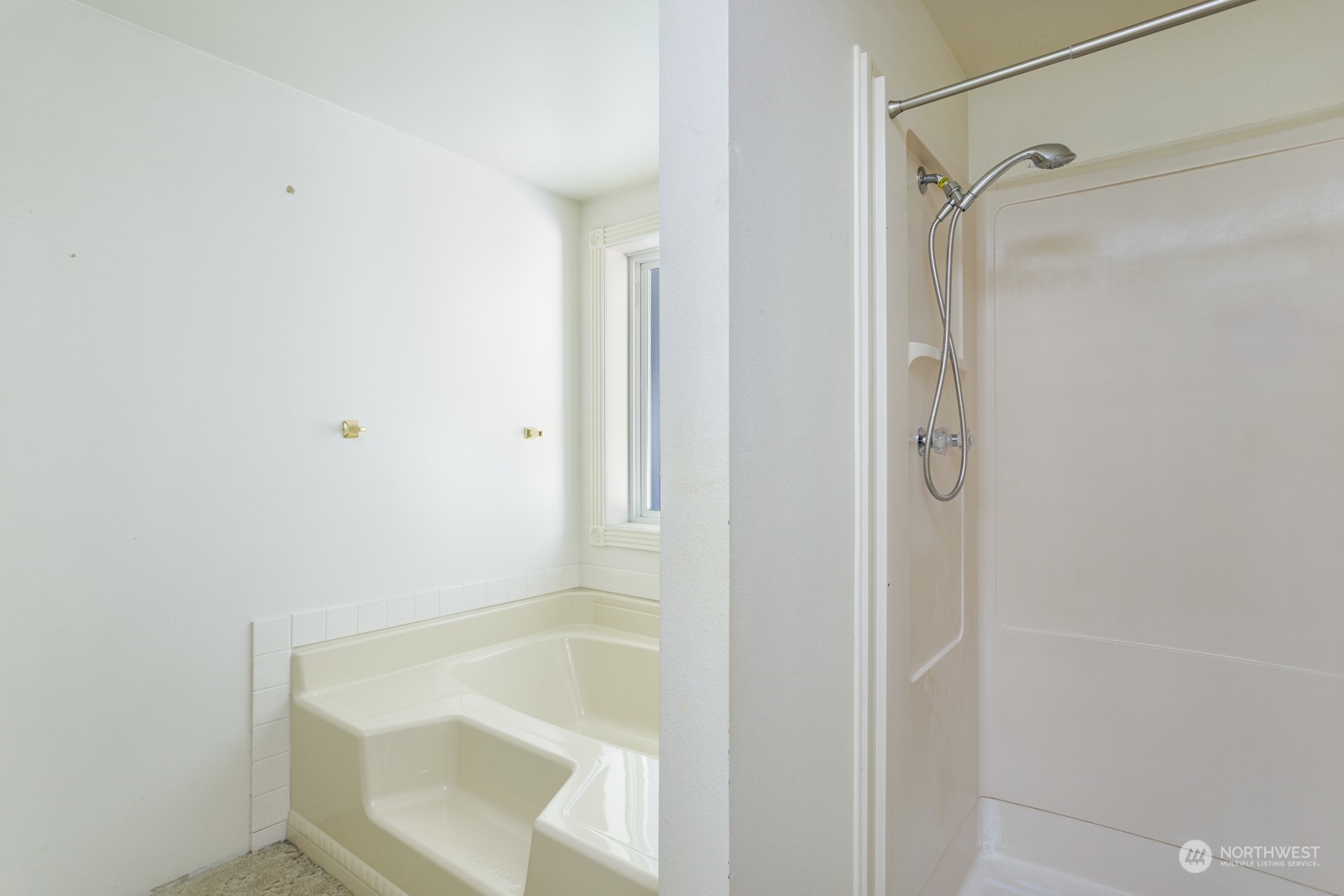 23725 Lake Drive East Bothell, WA 98021 - Photo 15 of 21 a bathroom with a tub