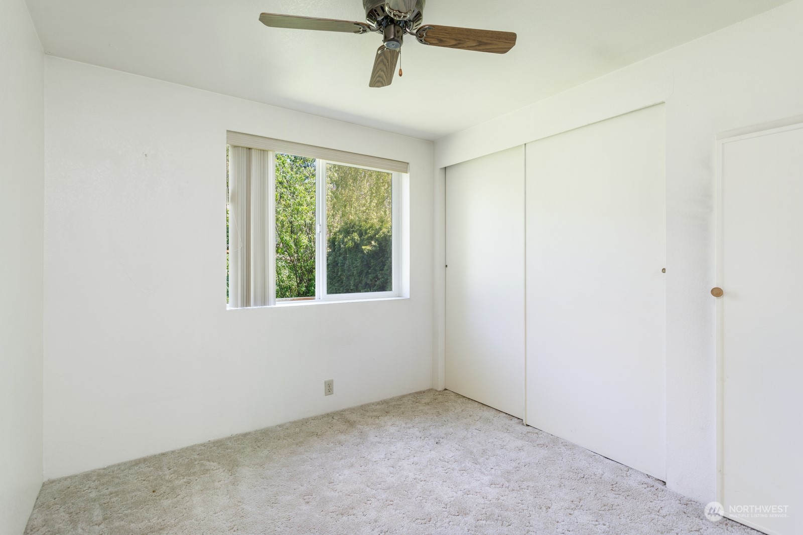 23725 Lake Drive East Bothell, WA 98021 - Photo 17 of 21 an empty room with a window