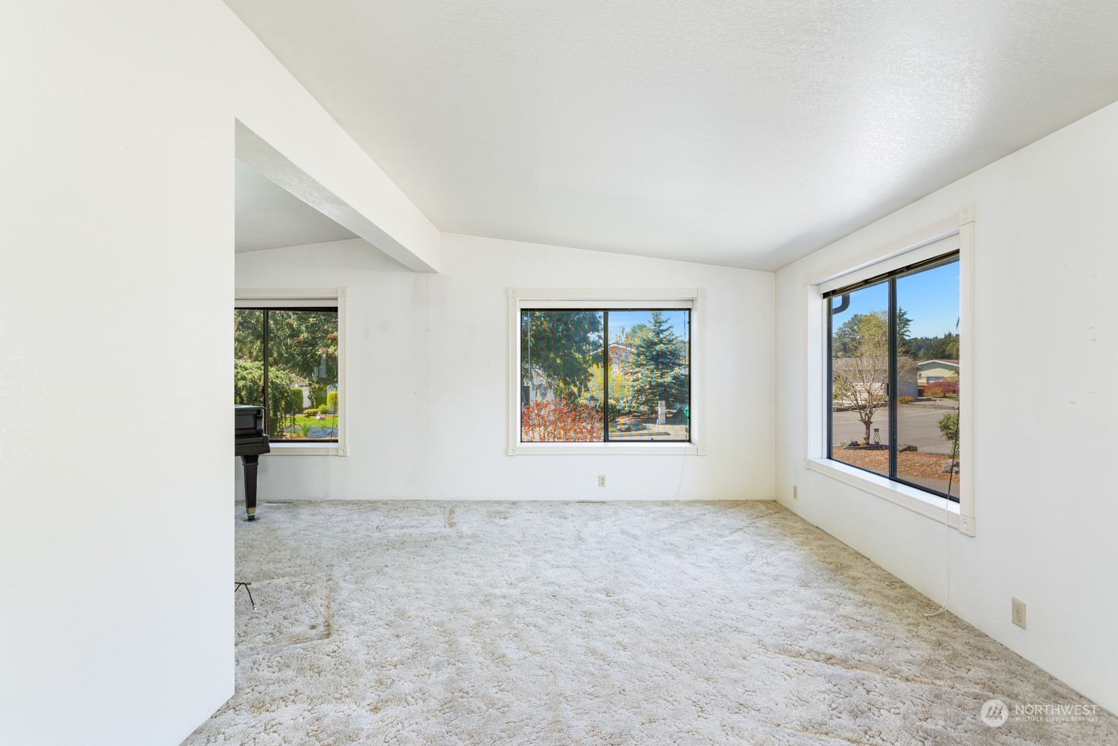 23725 Lake Drive East Bothell, WA 98021 - Photo 5 of 21 an empty room with windows