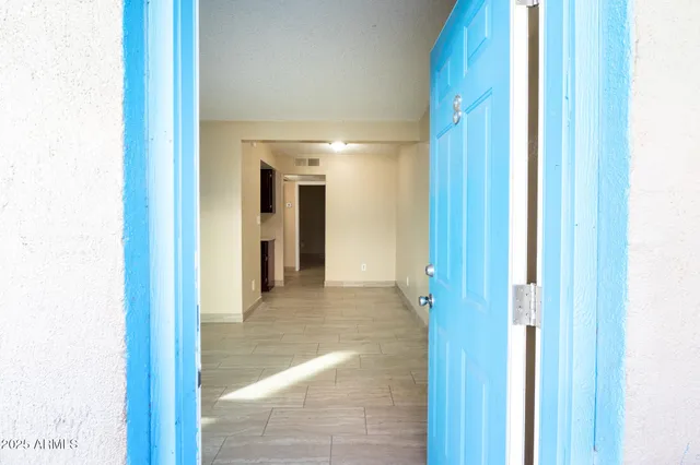 a view of a hallway and closet