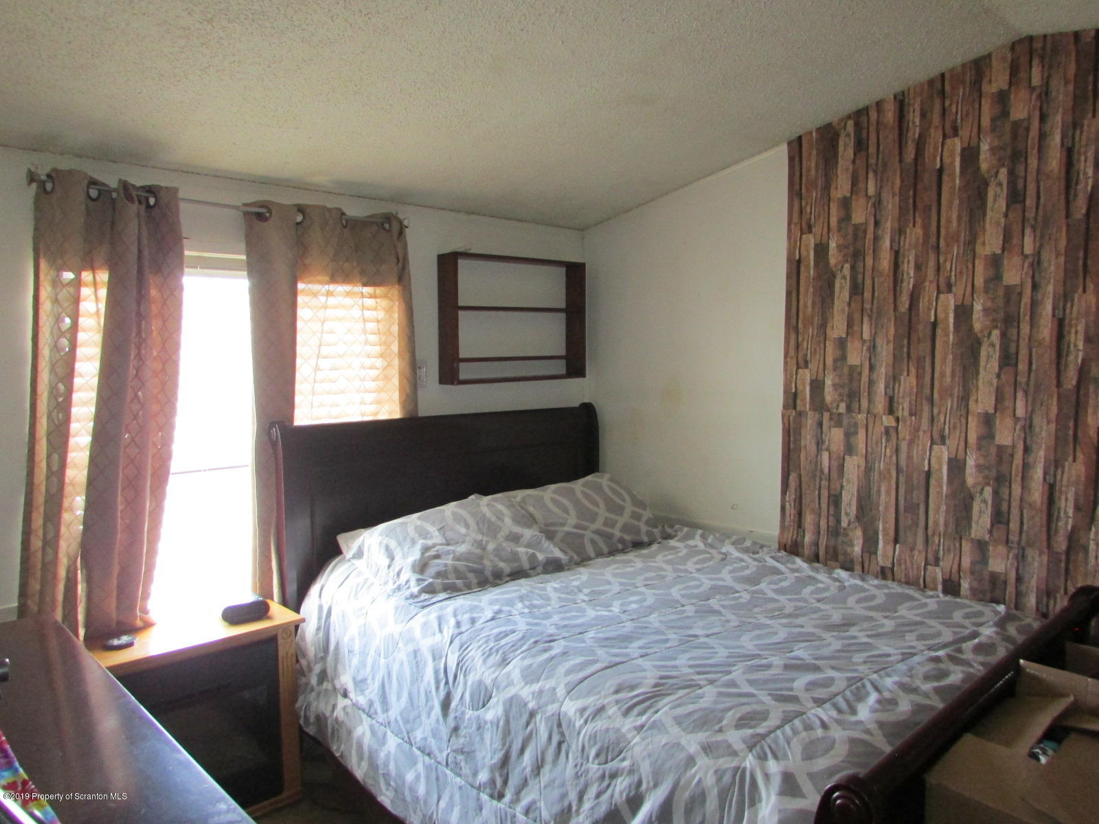 636 State Rte 3021 Springville, PA 18844 - Photo 12 of 16 a bedroom with a bed and a window
