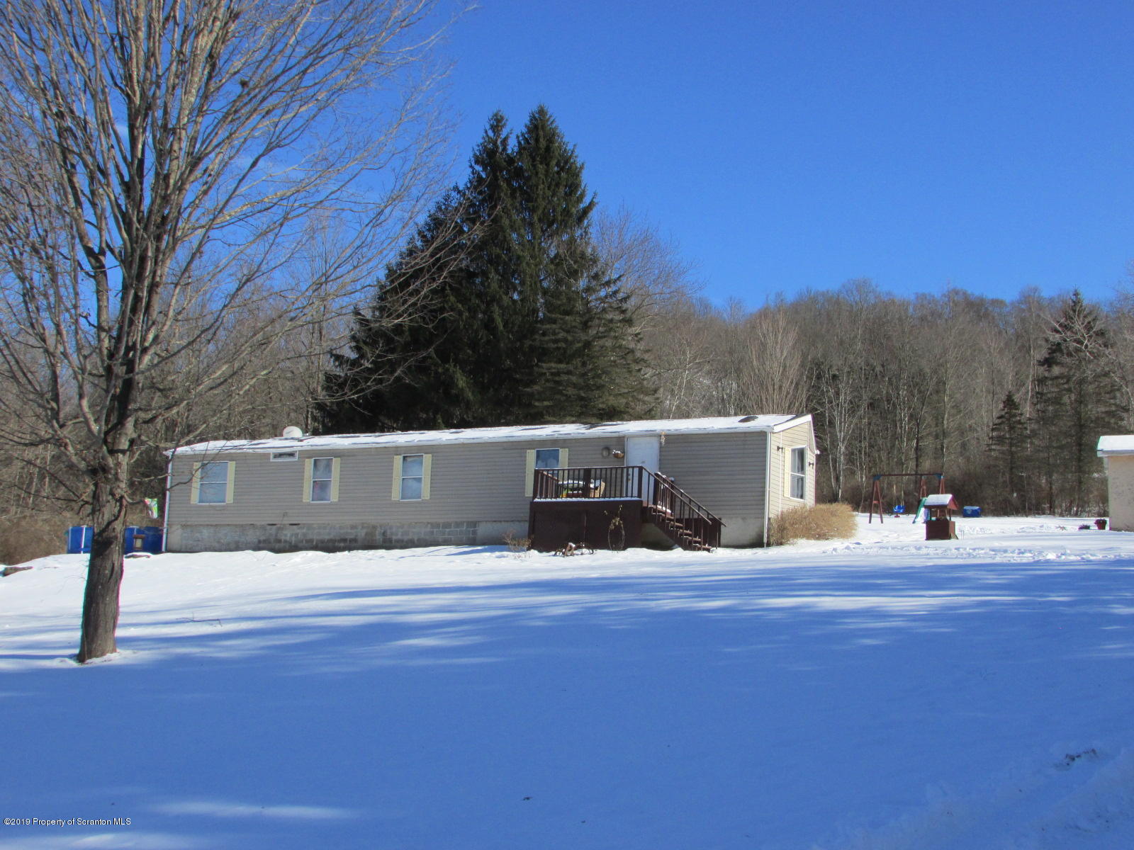 636 State Rte 3021 Springville, PA 18844 - Photo 13 of 16 a view of white house with a yard