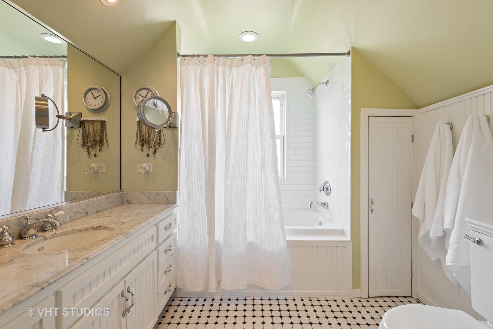 339 Maple Avenue Wilmette, IL 60091 - Photo 22 of 33 a bathroom with a granite countertop sink a mirror and a shower