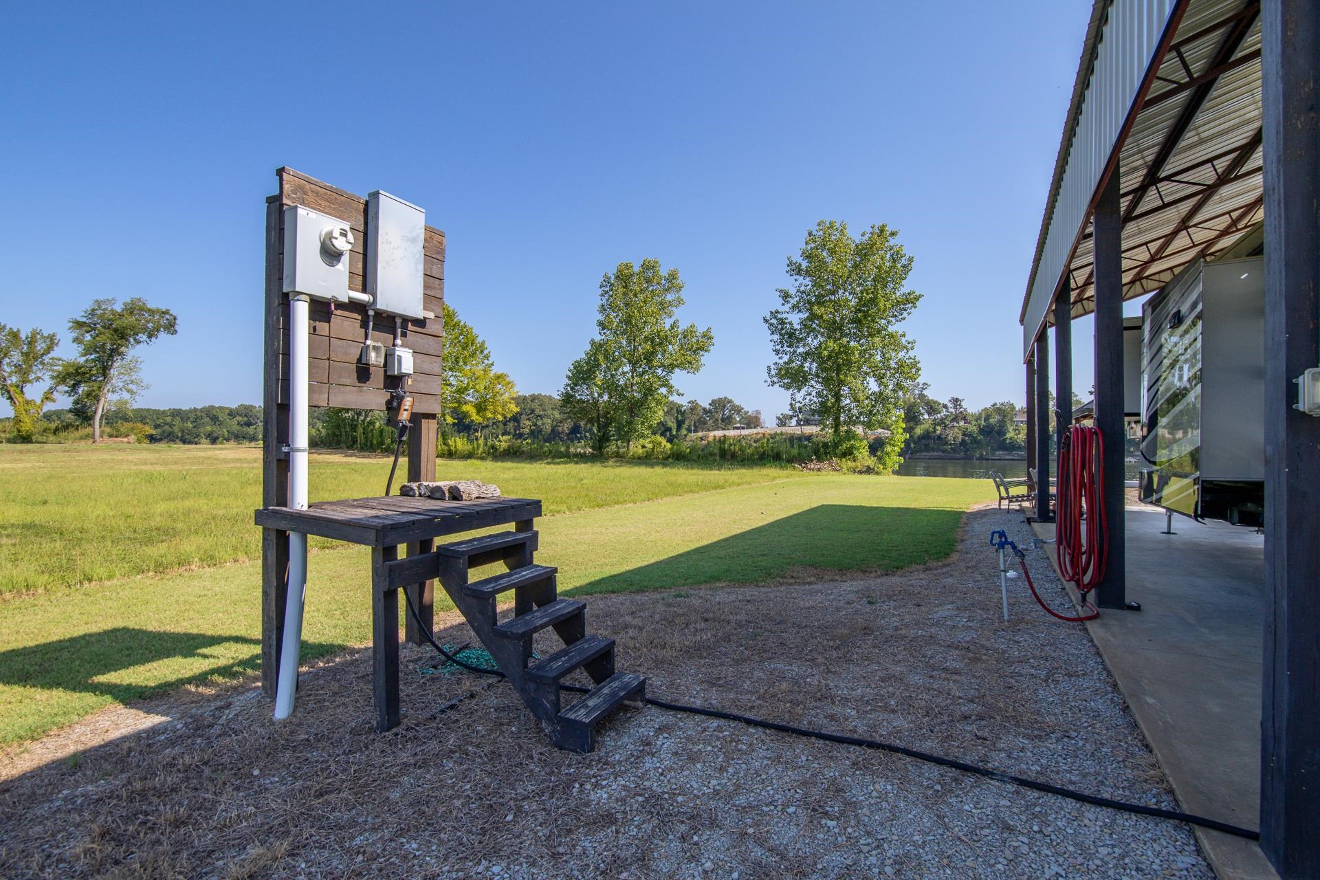 6235 Cravens Road Savannah, TN 38372 - Photo 11 of 11 a view of a water with a swimming pool and a yard