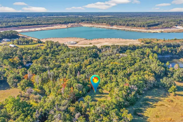 a view of a yard with swimming pool