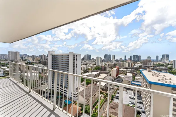a view of a balcony with wooden floor
