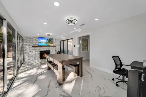 a kitchen with a table and chairs