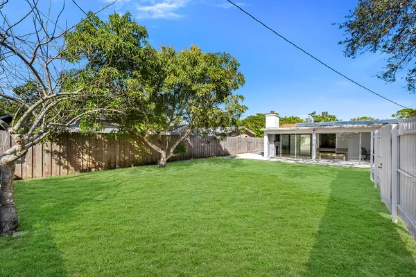 an aerial view of a houses with yard