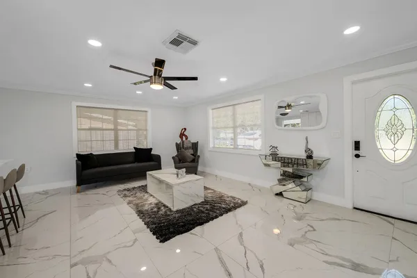 a living room with furniture and a large window