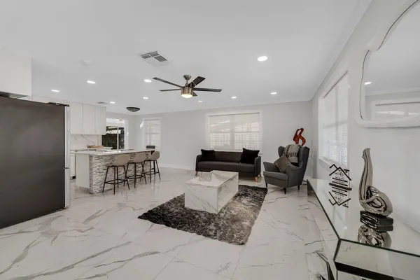 a living room with furniture and a rug