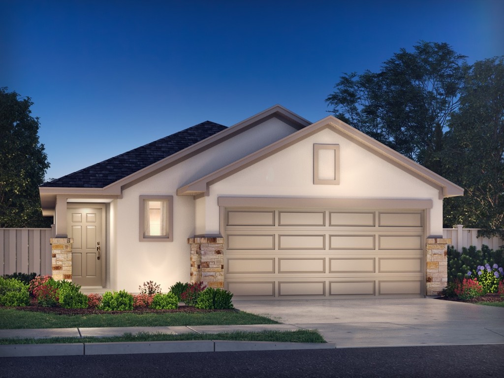 a view of a white house with a yard and potted plants