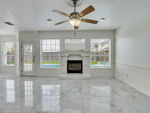 a view of an empty room with windows