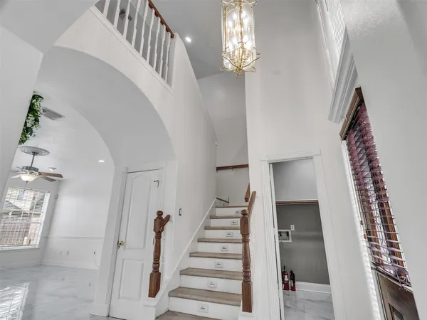 a view of entryway with furniture and wooden floor