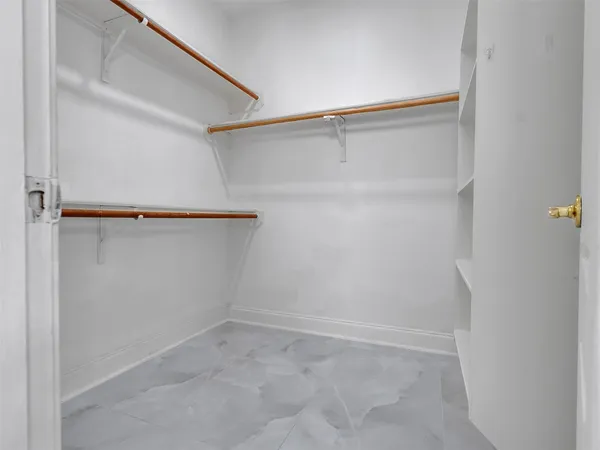 a view of an empty walk in closet