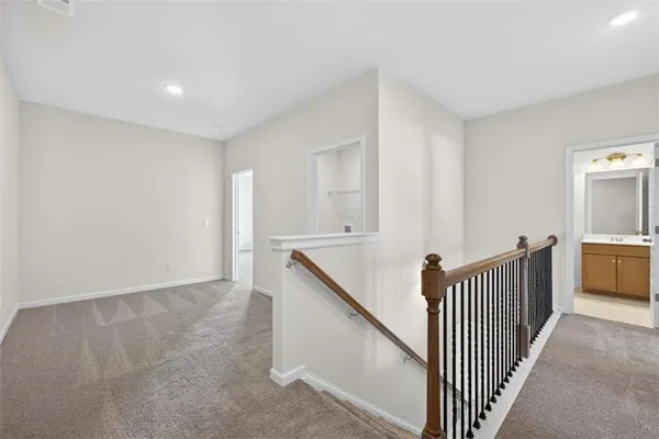 a view of a hallway with an entryway