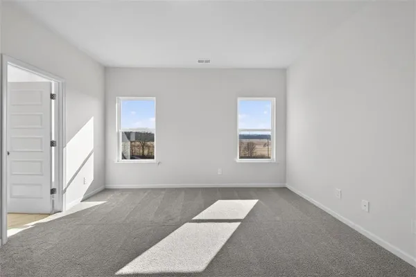 an empty room with windows