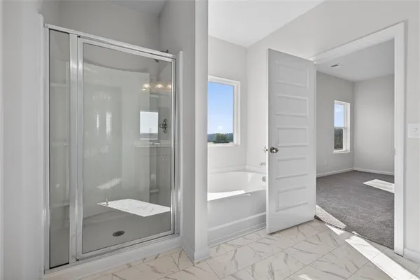 wooden bathroom with a glass shower door and mirror