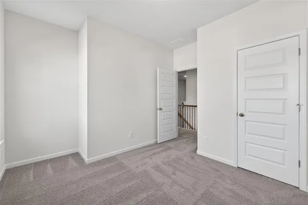 a view of an empty room and closet