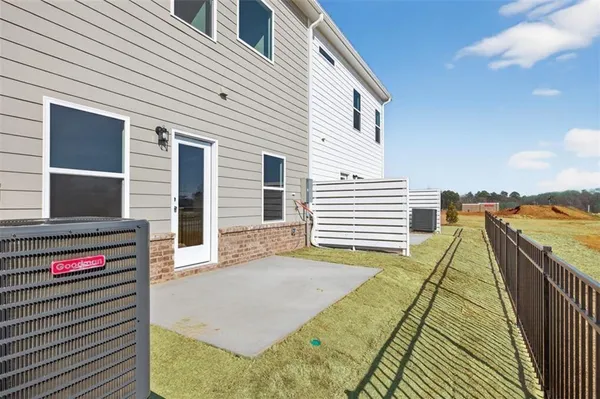 a view of a balcony with wooden floor and fence