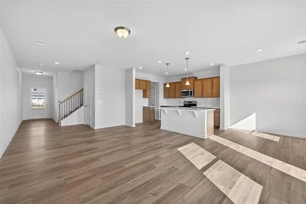 a view of kitchen with cabinets and wooden floor