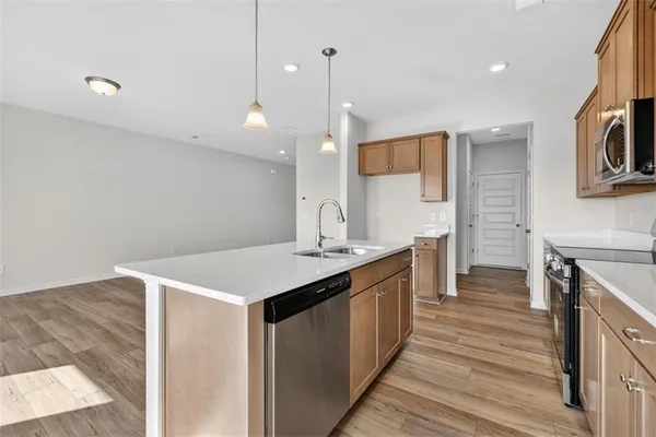 a kitchen with a sink and stove