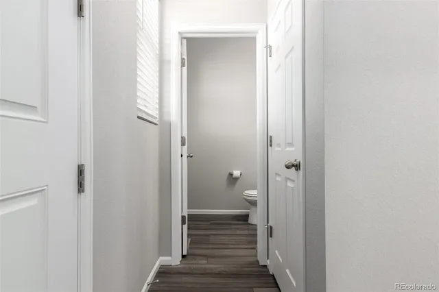 a view of a bathroom from a hallway
