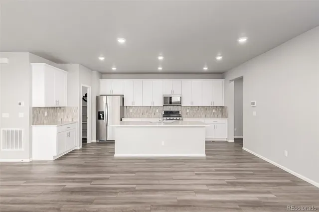 a view of kitchen with wooden floor