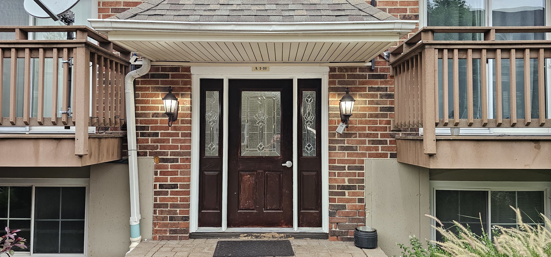 833 Village Quarter Road, Unit A3 West Dundee, IL 60118 - Photo 2 of 27 a front view of a house with glass windows