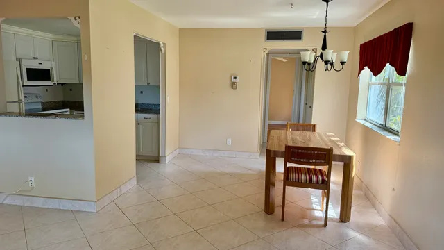 a bathroom with a sink mirror vanity and toilet